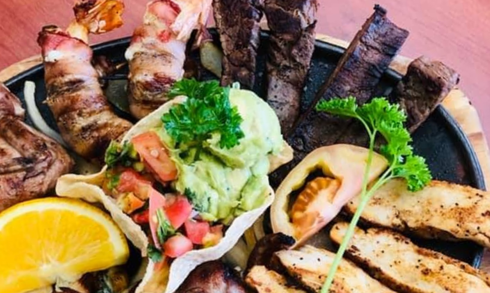 El Bosque - Chicken & Beef Fajitas with Bacon Wrapped Shrimp special - Photo By El Bosque