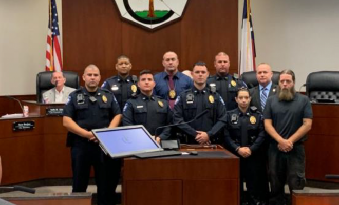 Conroe PD Officers and a Conroe resident being recognized by Chief Jeff Christy for Imelda.