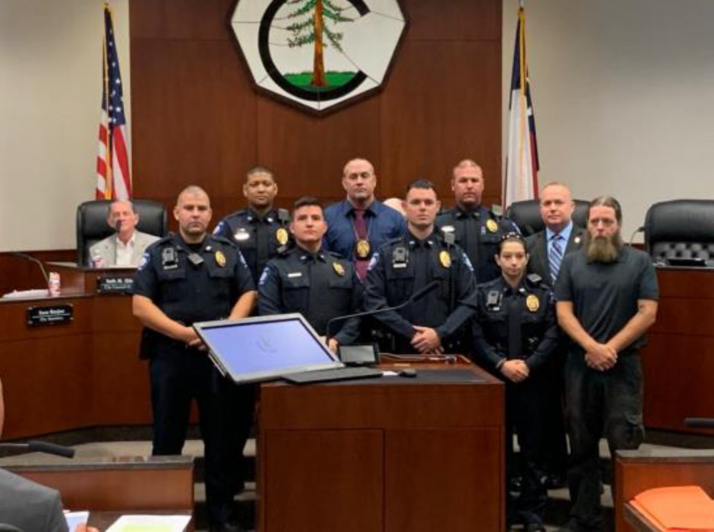 Conroe PD Officers and a Conroe resident being recognized by Chief Jeff Christy for Imelda.