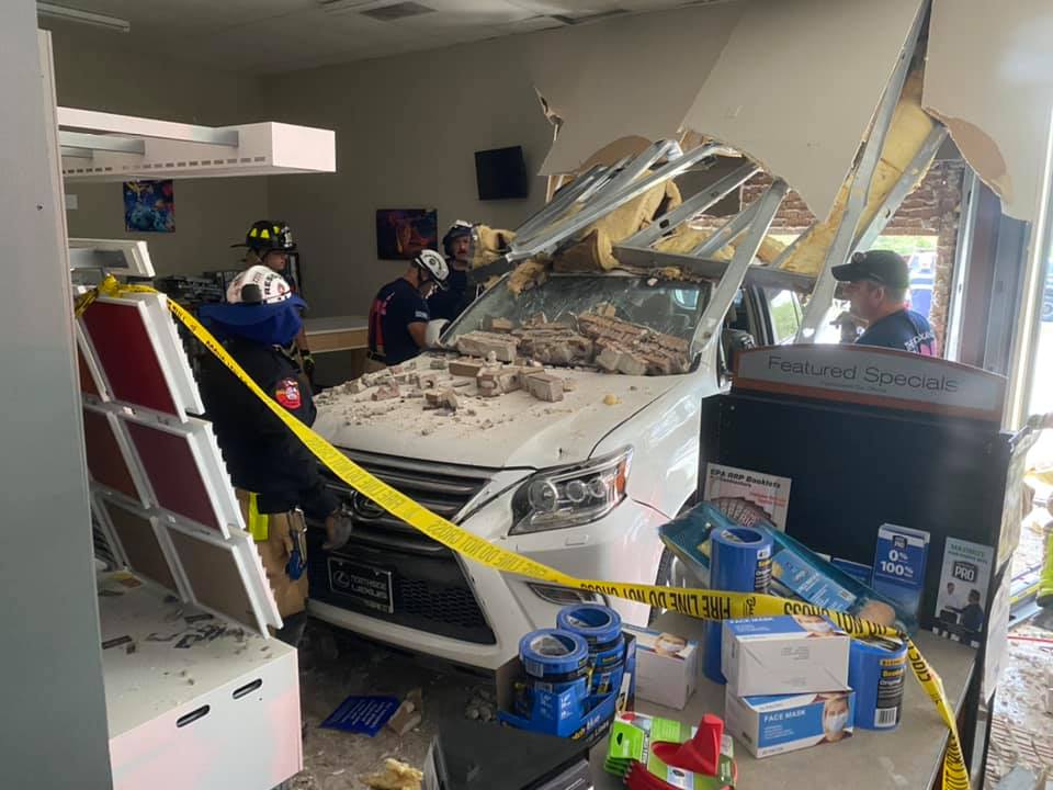 The Woodlands Fire Deparment responds to vehicle crash into Sherwin-Williams store at Alden Bridge Village Center.