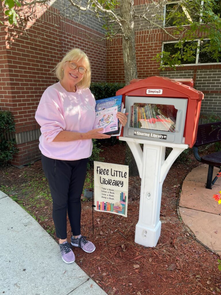 Cynthia Woods Mitchell Pavilion Book Donation to Boni’s