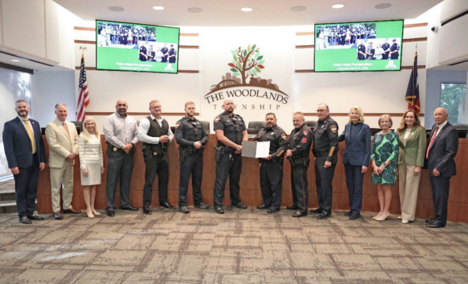 The Woodlands Township Board of Directors is pictured alongside members of local law enforcement in celebration of National Police Week.