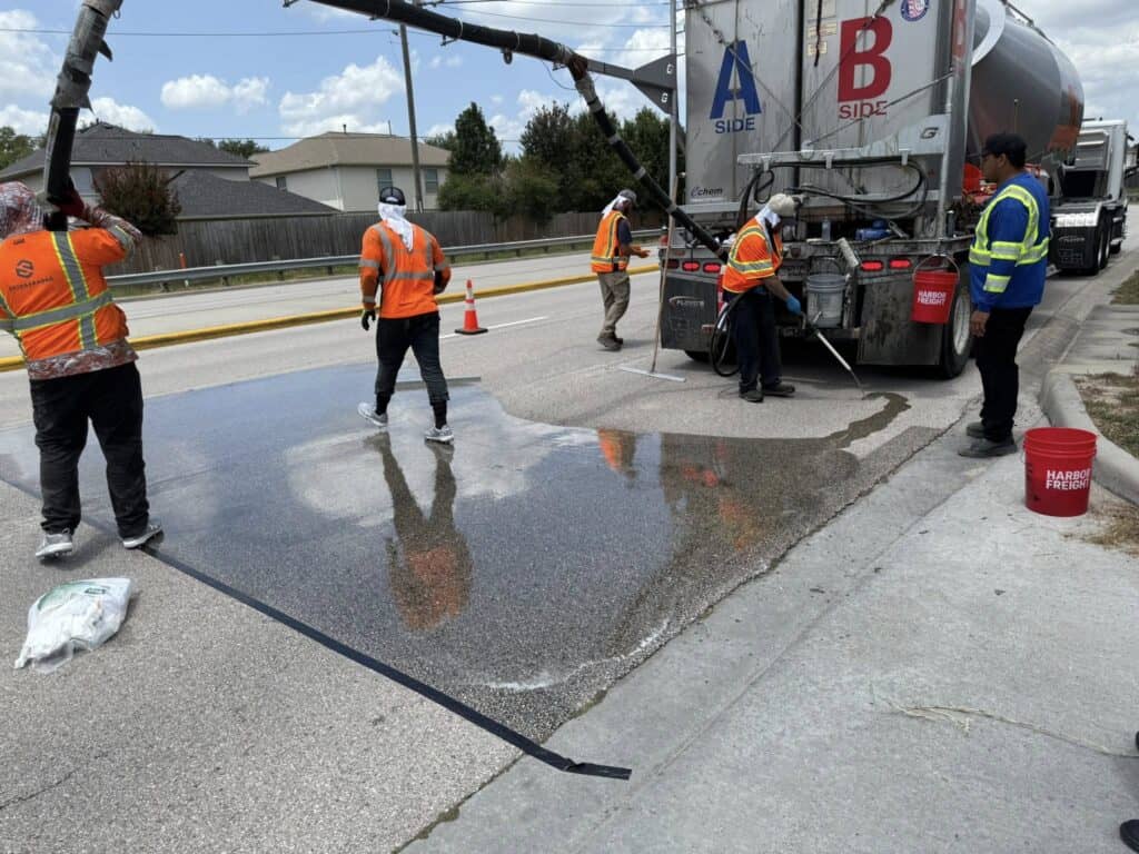 Precinct 3 applies High-Friction Surface Treatment to improve safety on Rayford Road’s S Curve