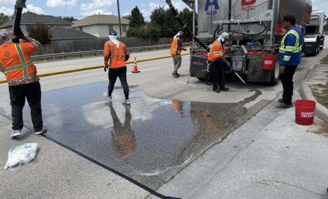 Precinct 3 applies High-Friction Surface Treatment to improve safety on Rayford Road’s S Curve
