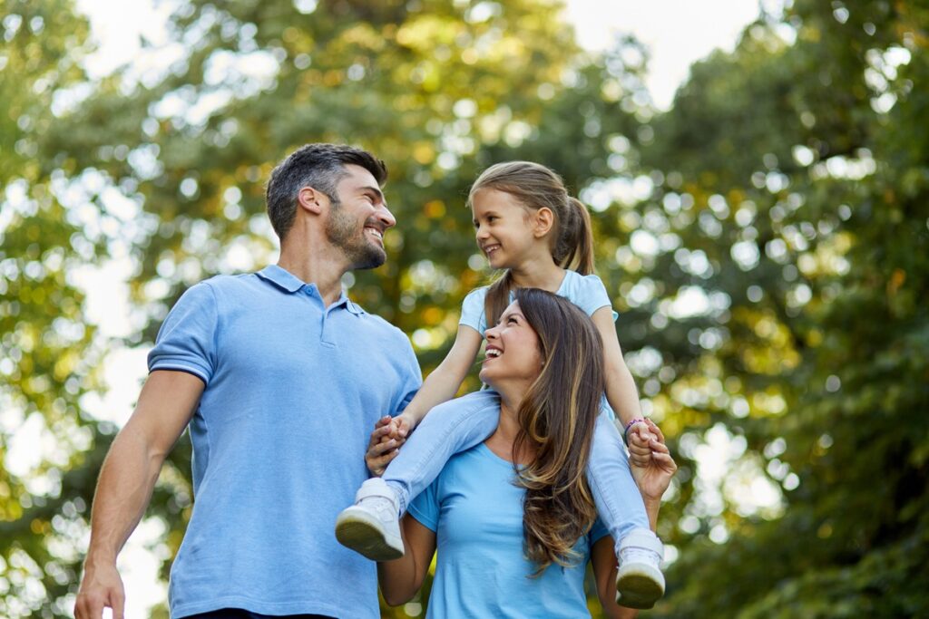 Happy family enjoying spending time together in the park