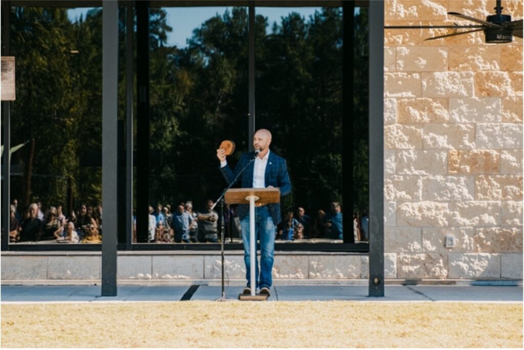 Rev. Brent Parker, Pastor of The Church at Woodforest, speaks to the congregation gathered for worship and groundbreaking.