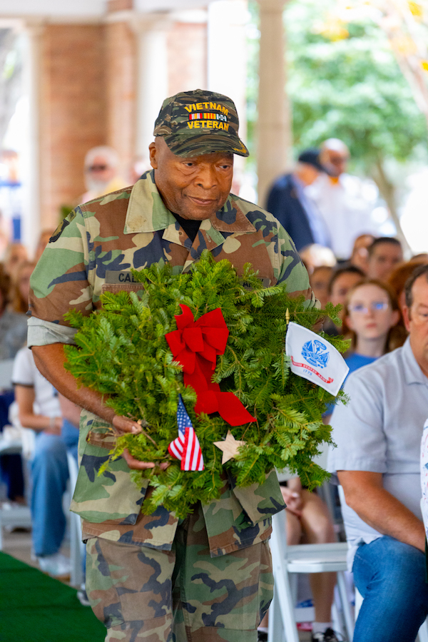 Procession of Wreaths for each branch of the military followed by POW/MIA wreath, Gold Star Mothers, and Blue Star Mothers.