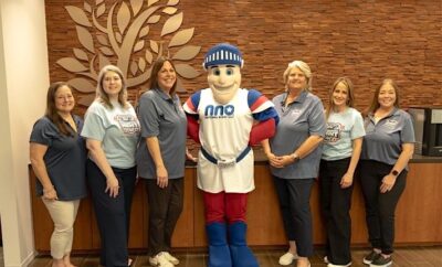Township Neighborhood Services staff, along with Nat the Knight, the national mascot of the National Association of Town Watch.