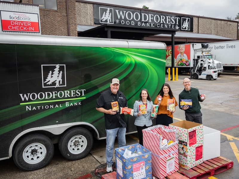 Woodforest National Bank makes a Holiday Helpings Food and Funds Drive donation.