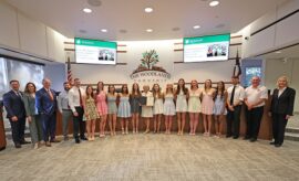 Board of Directors with the Lady Highlanders Swim