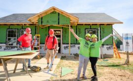 Future Habitat homeowners work alongside volunteers to build their home