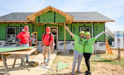 Future Habitat homeowners work alongside volunteers to build their home