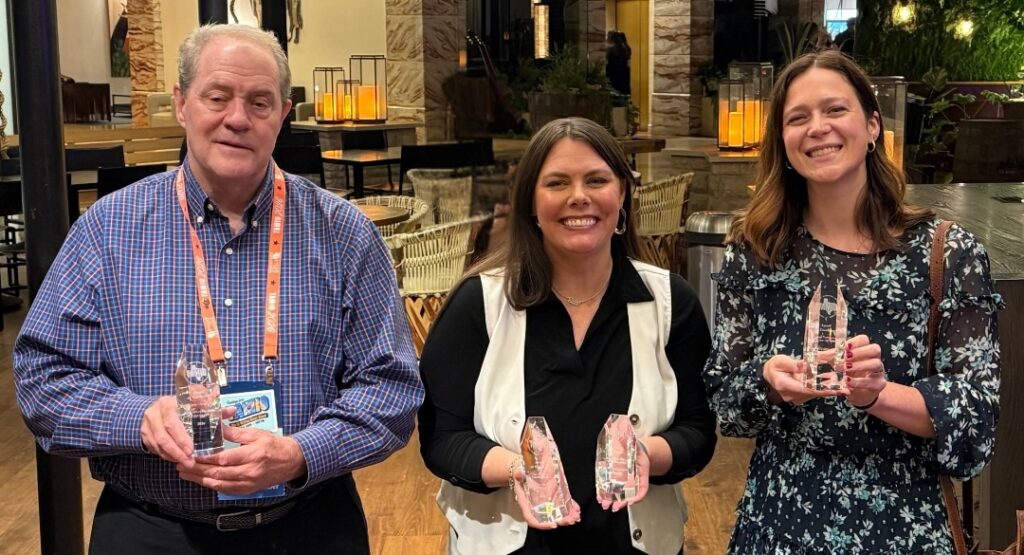 Pictured above are Township Senior Communications Specialist Perry Frank, Director of Communications LeaAnn Petersen and Graphic Designer Jaclyn Ballou, along with the awards from the 2026 Texas Association of Municipal Information Officers (TAMIO) competition.