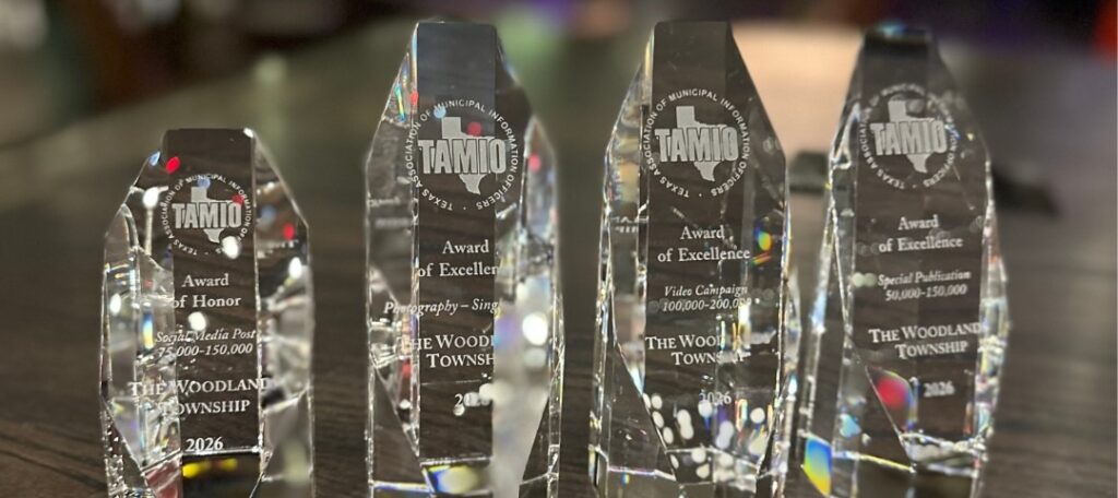Pictured above are Township Senior Communications Specialist Perry Frank, Director of Communications LeaAnn Petersen and Graphic Designer Jaclyn Ballou, along with the awards from the 2026 Texas Association of Municipal Information Officers (TAMIO) competition.