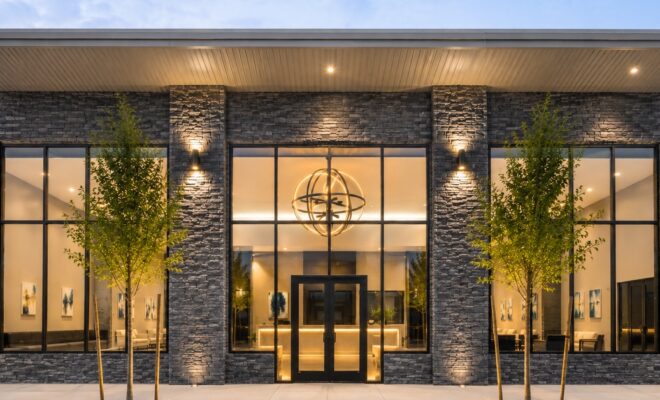 Discovery School of Innovation’s new six-acre campus in The Woodlands area features a modern stone façade and welcoming entrance.