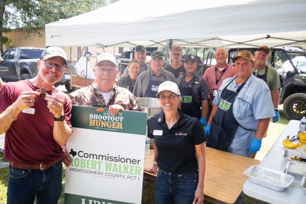 From left: Scott Burns, President & CEO, Montgomery County Food Bank; Precinct 1 Commissioner Robert Walker,
whose staff prepares the barbecue lunch each year; and former President & CEO Kristine Marlow.
