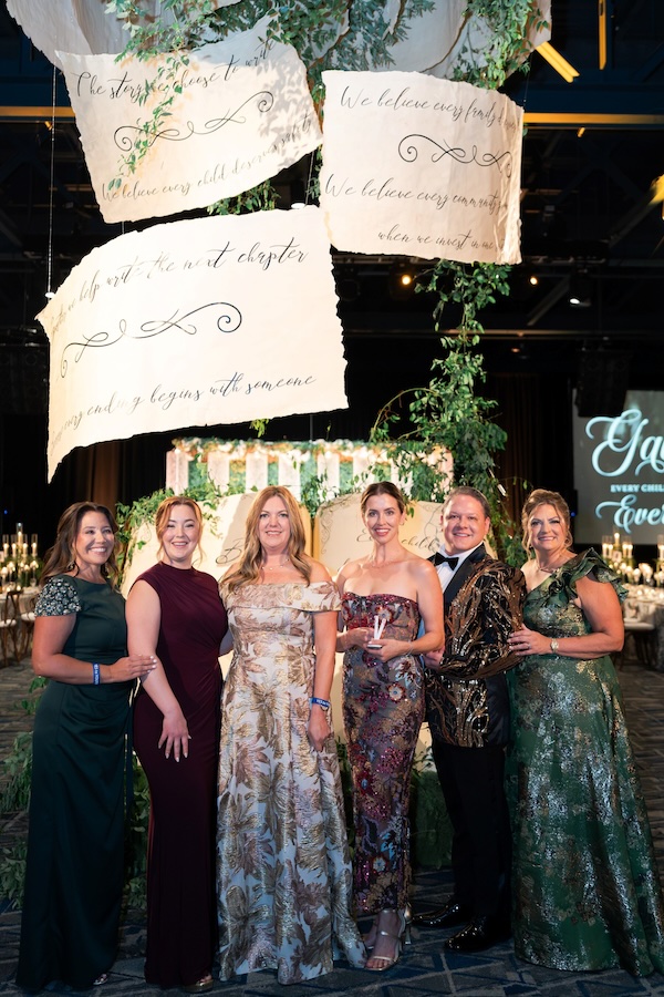 From left, Amber Scheer, gala co-chair; Rachel Ray, gala co-chair; Lauren Fox, gala co-chair; Kelly Andree, jewelry model; Evan Berlin, gala co-chair; and Michele Kooken, YES to YOUTH CEO. (Swish & Click Photography)