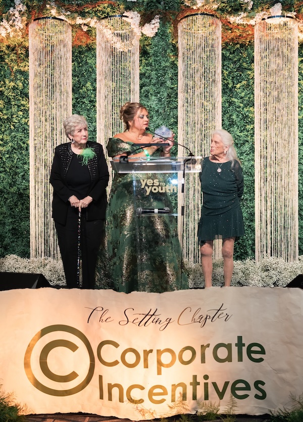 The 2026 gala Lifetime Legacy Honorees Sylvia Caracio (left) and Jacque Everson (right) are recognized by Michele Kooken, YES to YOUTH CEO. (Swish & Click Photography)
